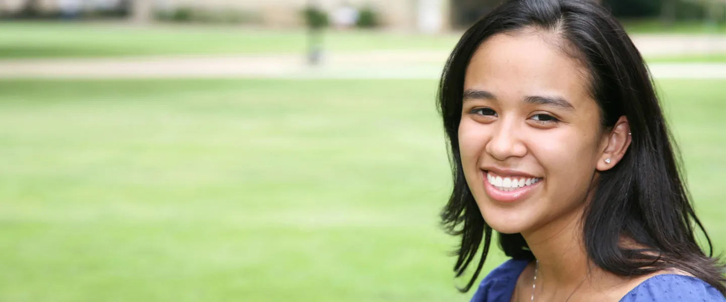 A smiling young woman.