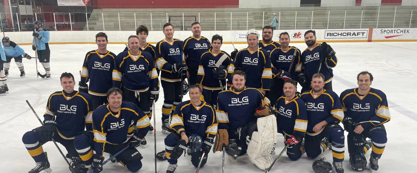 BLG hockey team photo in blue and yellow jerseys