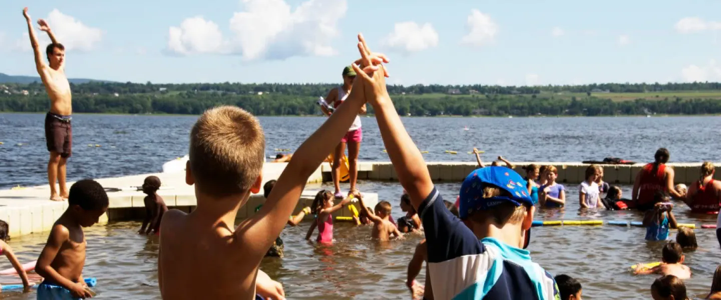 Campers swim in the river.