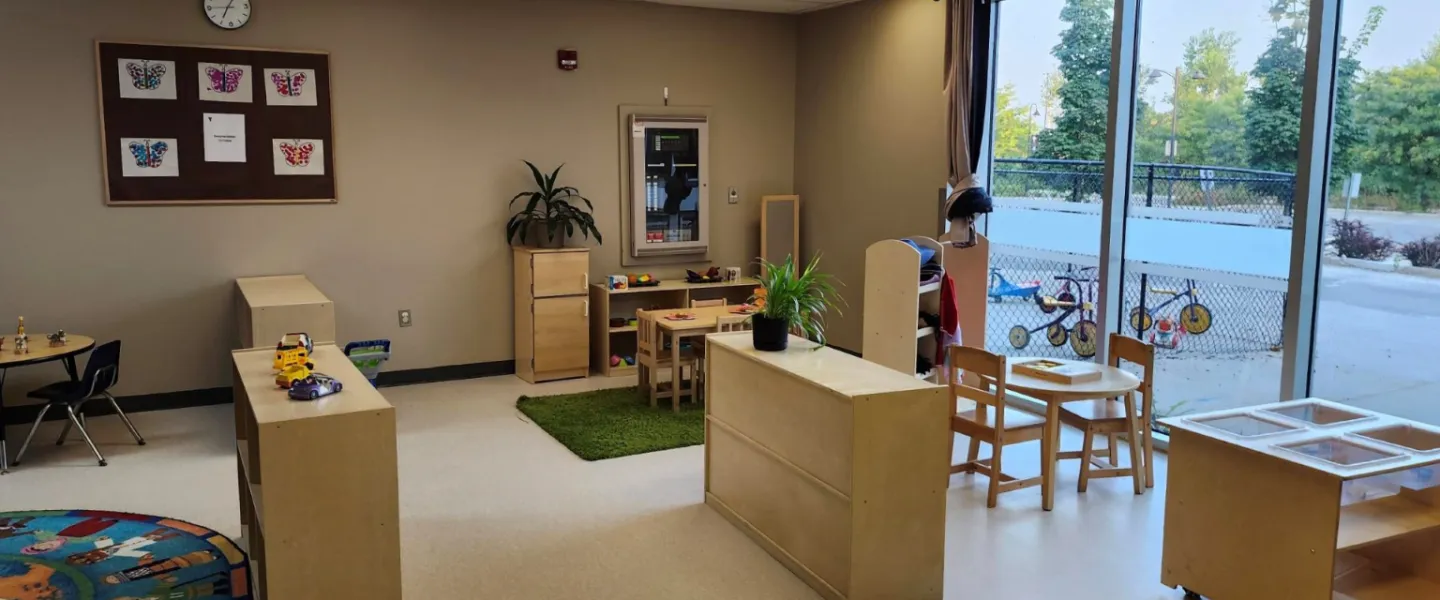 A room of furniture, plants, and toys at the Orleans Y Child Care Centre