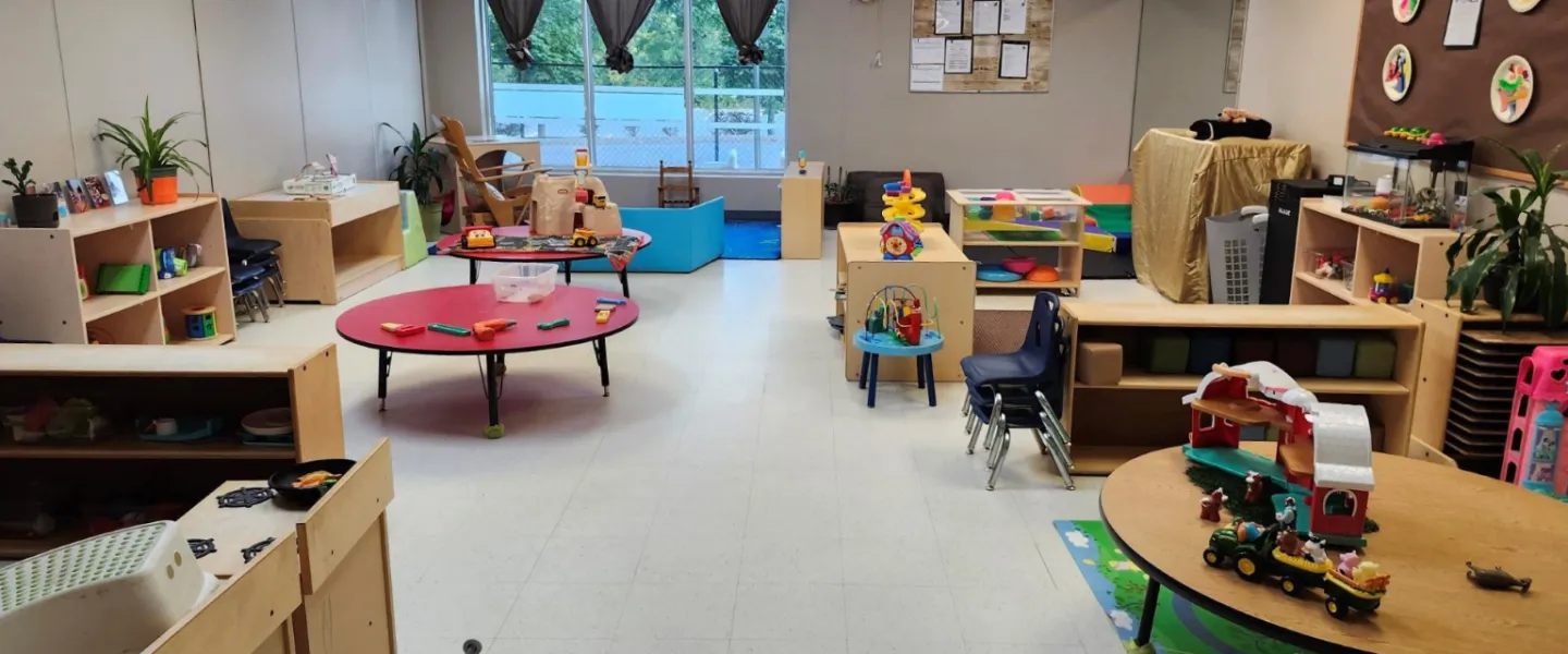 A room of furniture, plants, and toys at the Orleans Y Child Care Centre