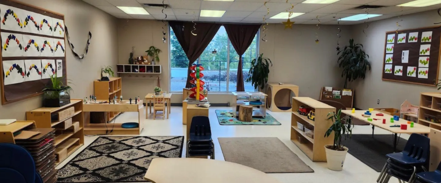 A room of furniture, plants, and toys at the Orleans Y Child Care Centre