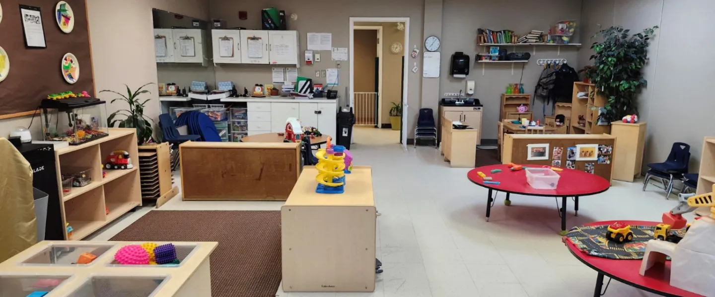 A room of furniture, plants, and toys at the Orleans Y Child Care Centre