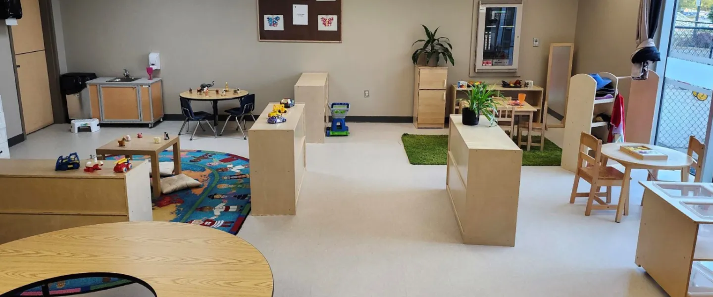 A room of furniture, plants, and toys at the Orleans Y Child Care Centre