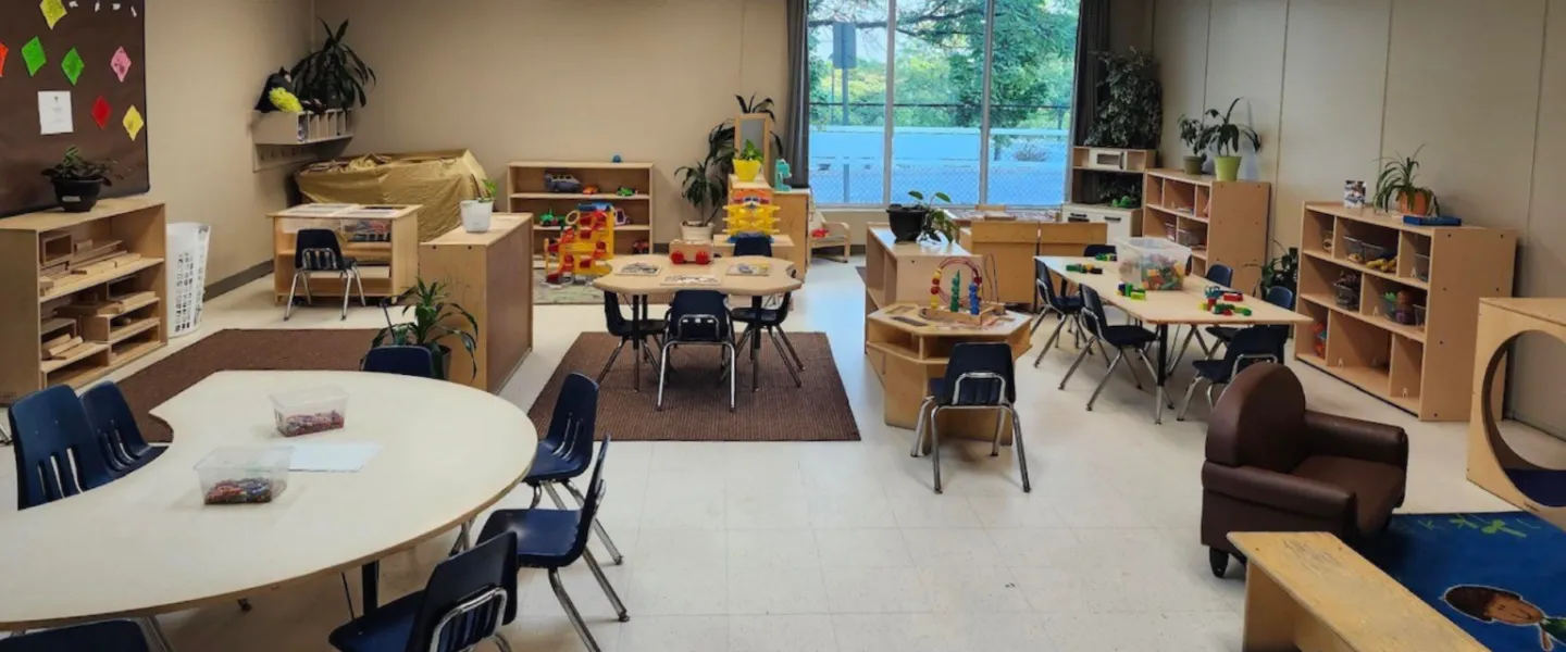 A room of furniture, plants, and toys at the Orleans Y Child Care Centre