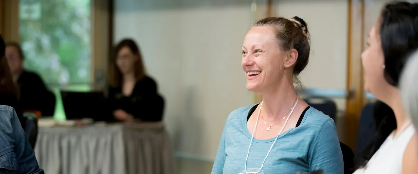 Smiling woman at a table in the Y