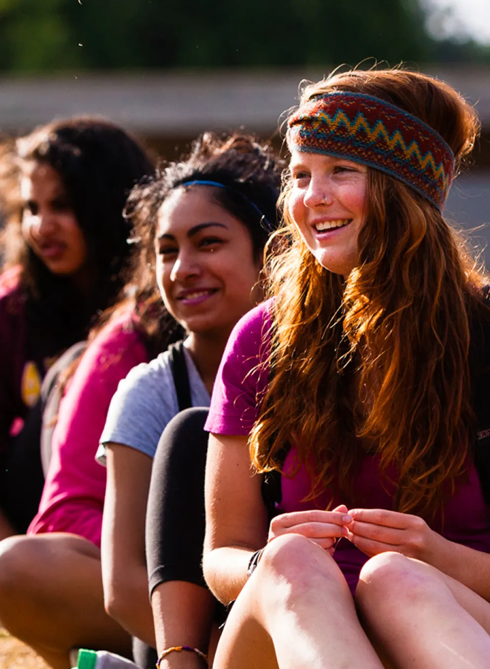 A group of teenage girls sitting together.