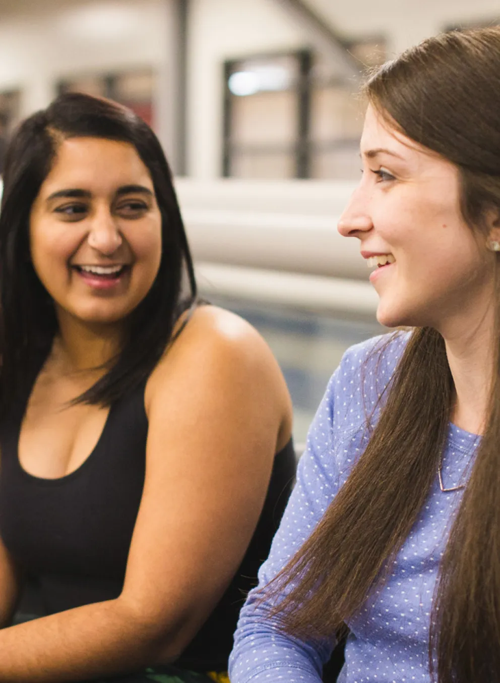 Three woman sitting together having a conversation.