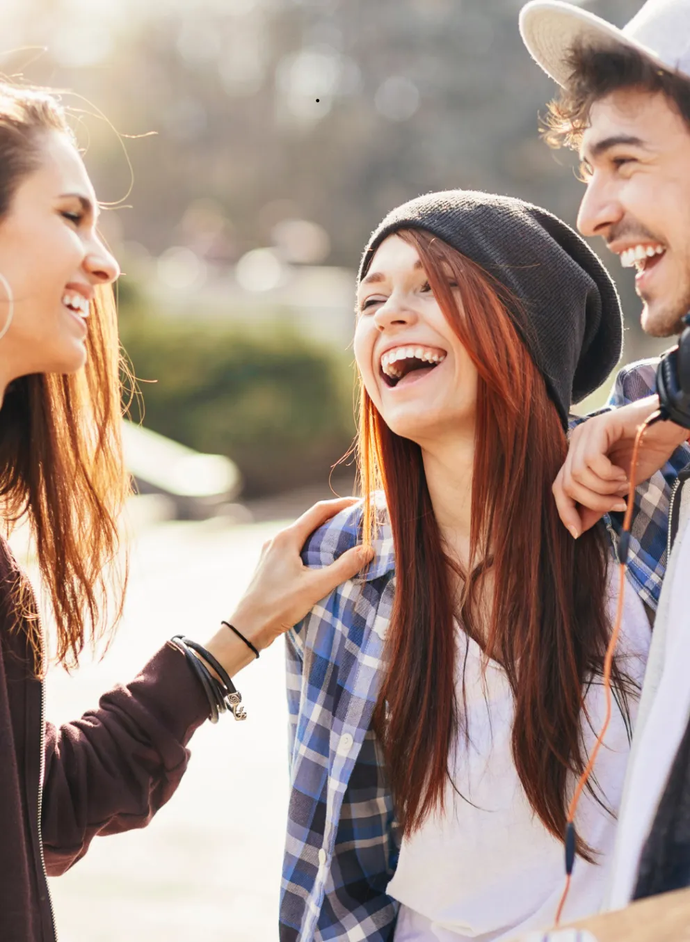 A group of youths talking and laughing.