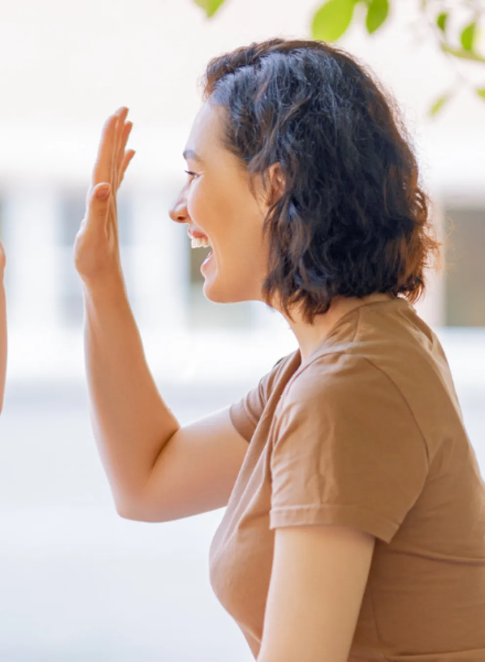 A mother and child high-five.