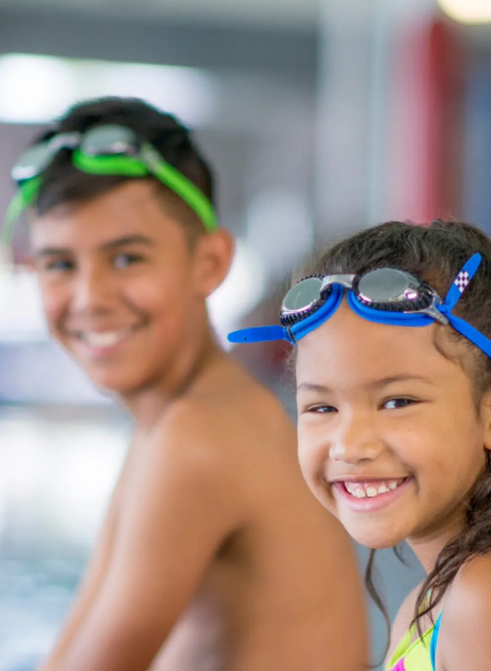 A group of kids playing at a pool