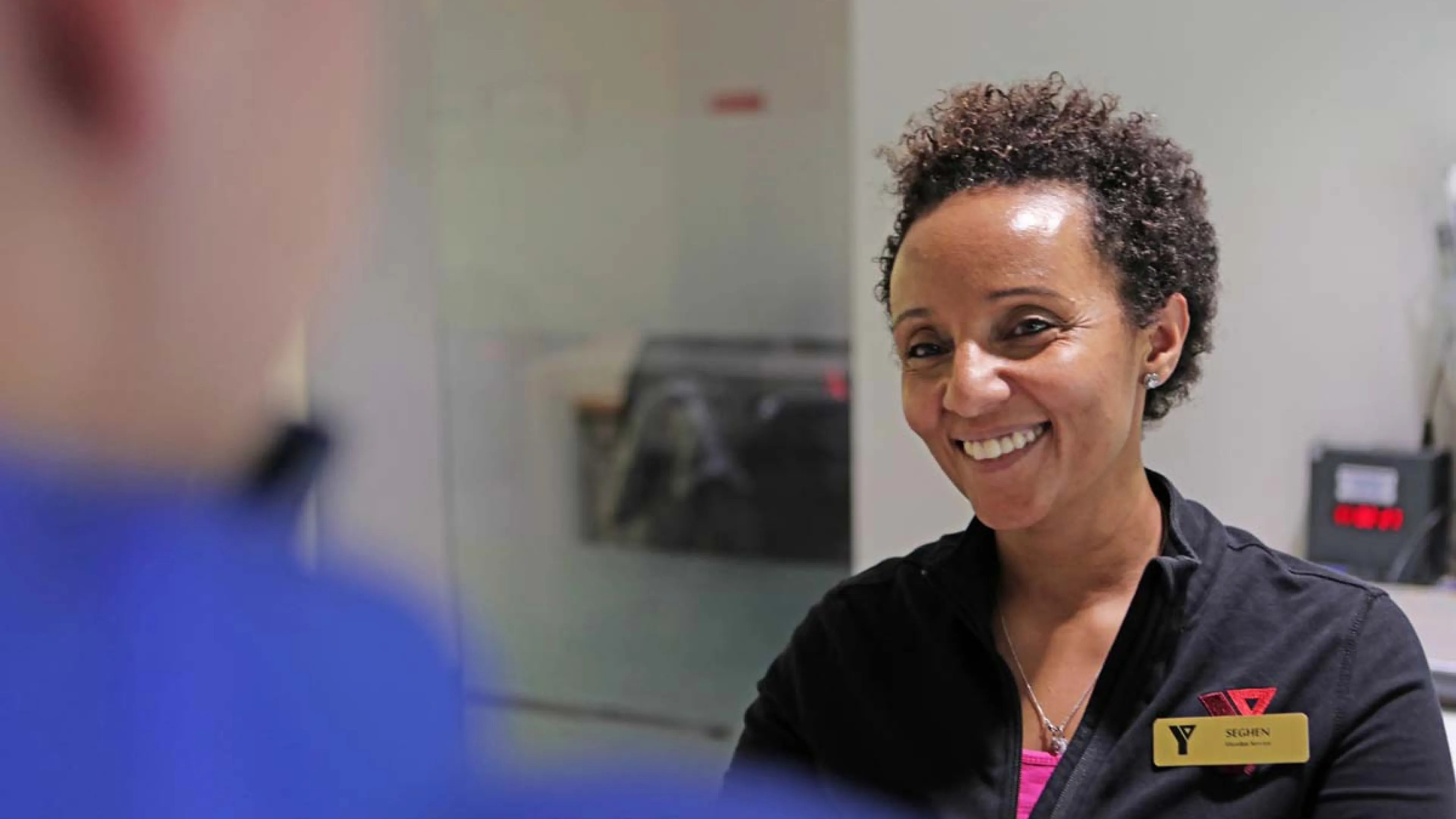 Y staff helping a client.