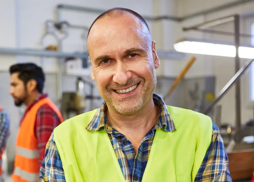 Man working with safety vest on.