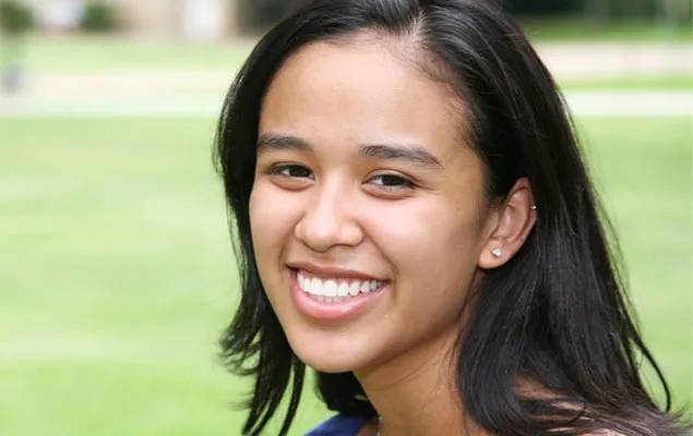 A smiling young woman.